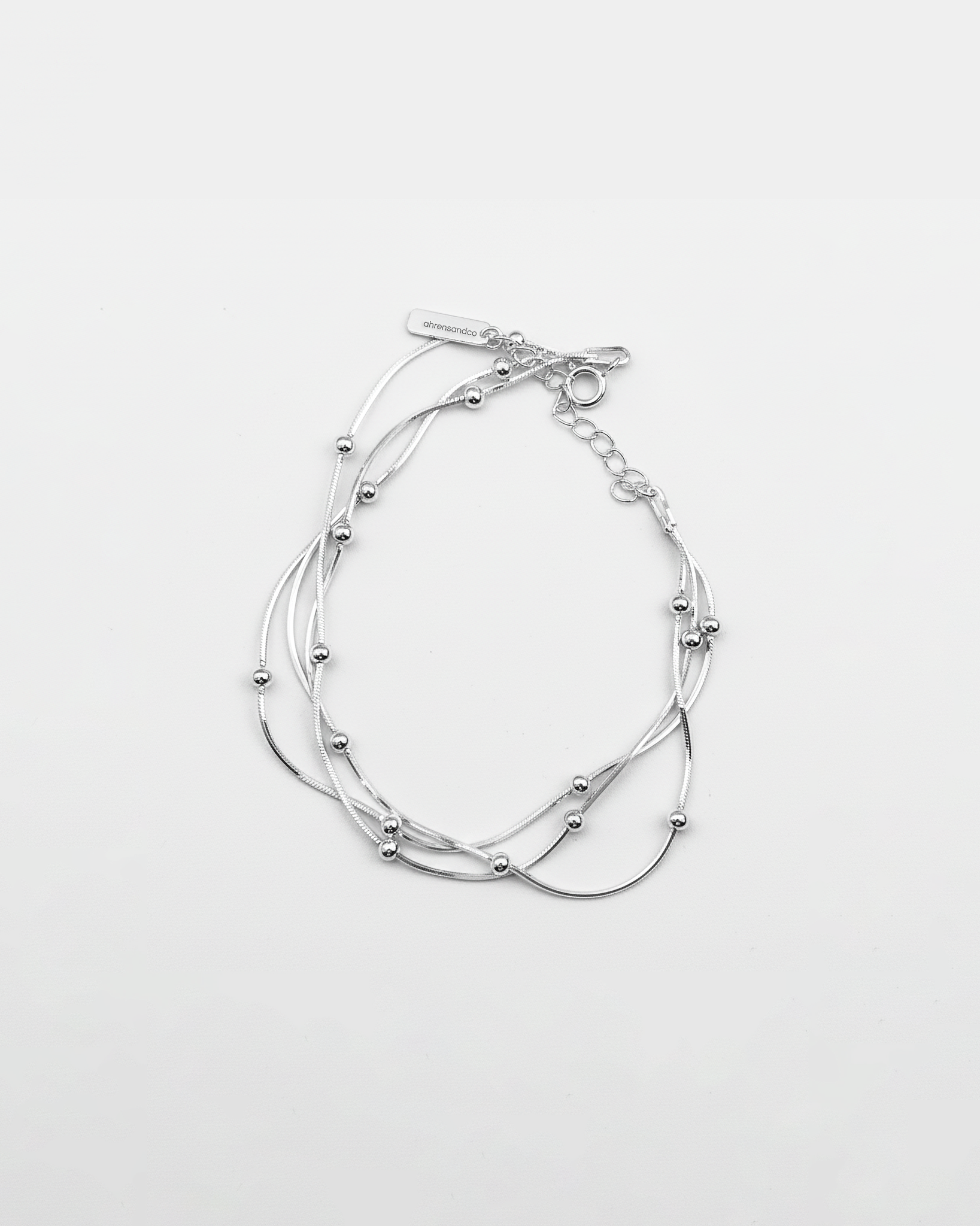 ahrensandco Trisfera Bracelet aus 925 Sterling Silber – verflochtenes Armband mit Gravur-Tag, minimalistisches Design, designed in Paris
